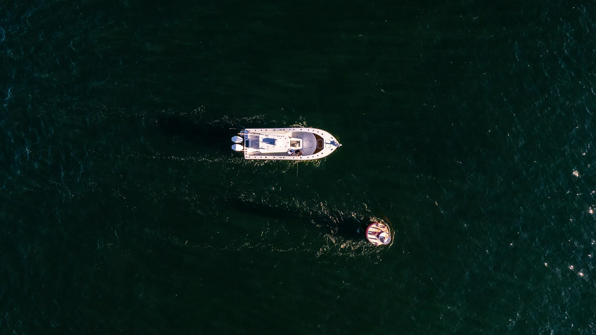 Center console boat on open water, aerial view